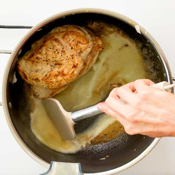 Deglazing the bottom of the pot.