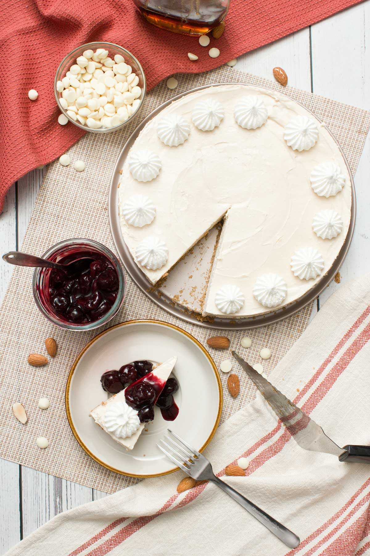 A slice of no-bake cottage cheese cheesecake taken out of a cheesecake on a plate.