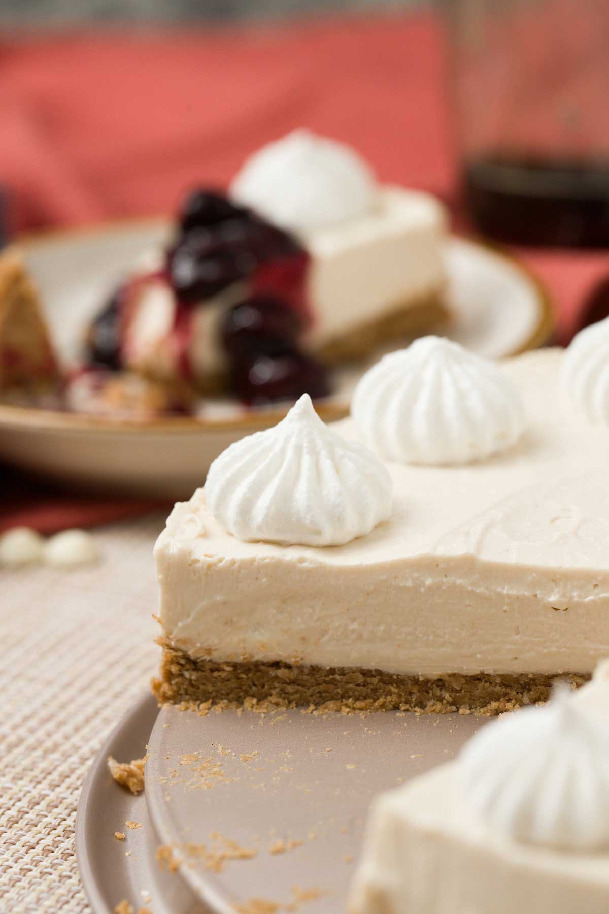 A slice of no-bake cottage cheese cheesecake with a gluten-free crust.
