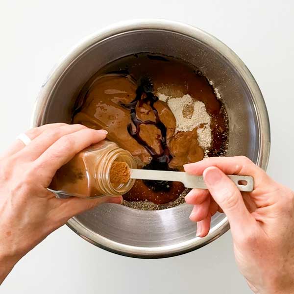 Adding the crust ingredients to a mixing bowl.