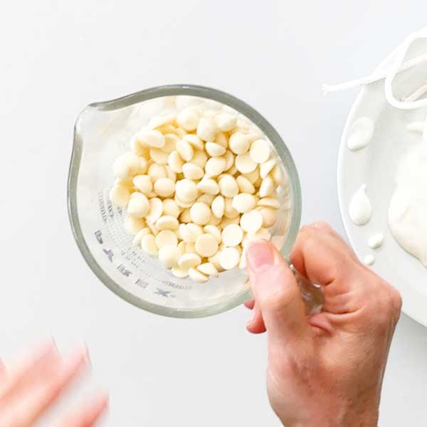 Melting the white chocolate chips in a glass measuring cup.