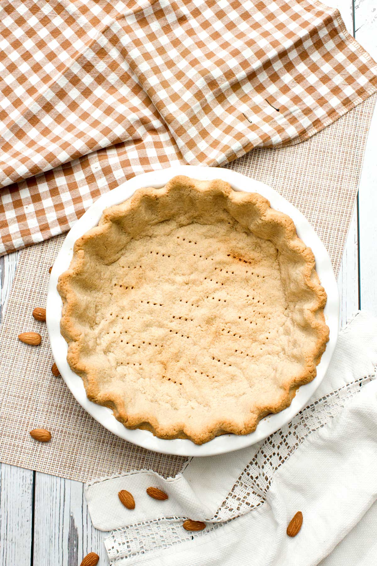 An almond flour pie crust in a pie plate.