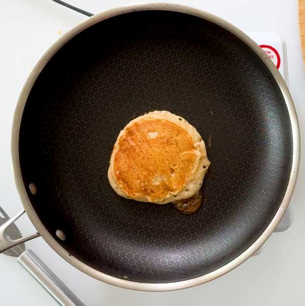 The pancake flipped over in the skillet.