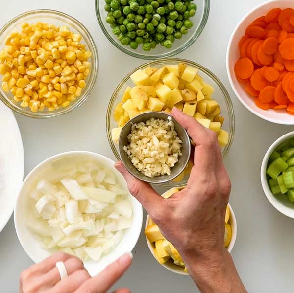 Dicing all the vegetables before beginning to make the soup.