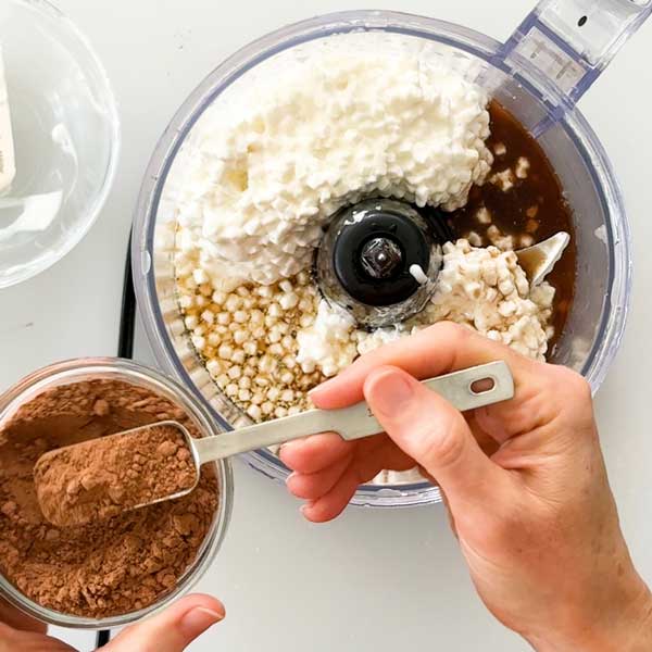 Adding all the filling ingredients to a food processor.