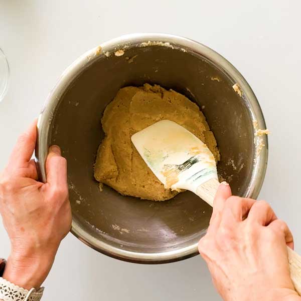 The mixed pie crust dough in a bowl.