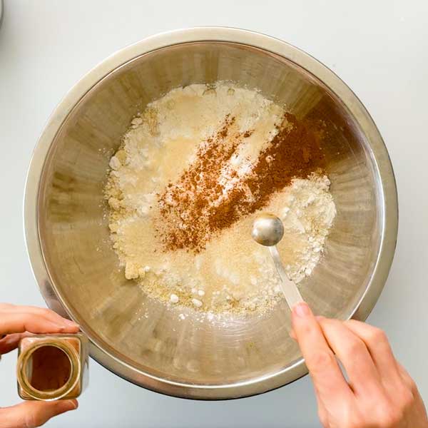 Adding all the dry ingredients to a mixing bowl.