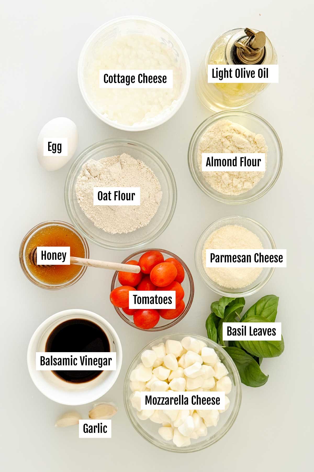 All the ingredients you need to make gluten-free crostinis with tomato, basil, and mozzarella cheese.