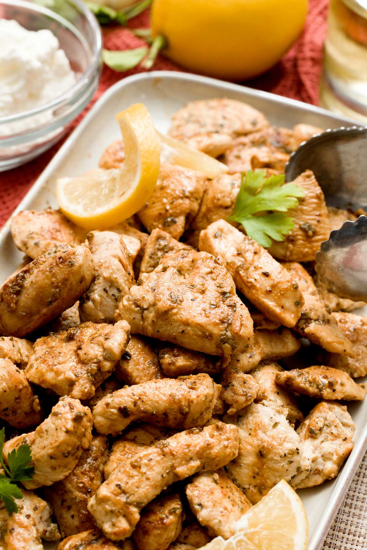 A close-up of greek yogurt marinated chicken breast.
