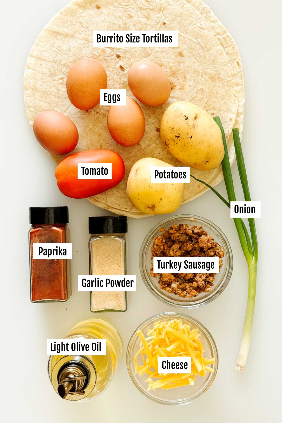 Everything you need to make high protein breakfast burritos with crispy potatoes, ground turkey sausage, scrambled eggs and cheese.
