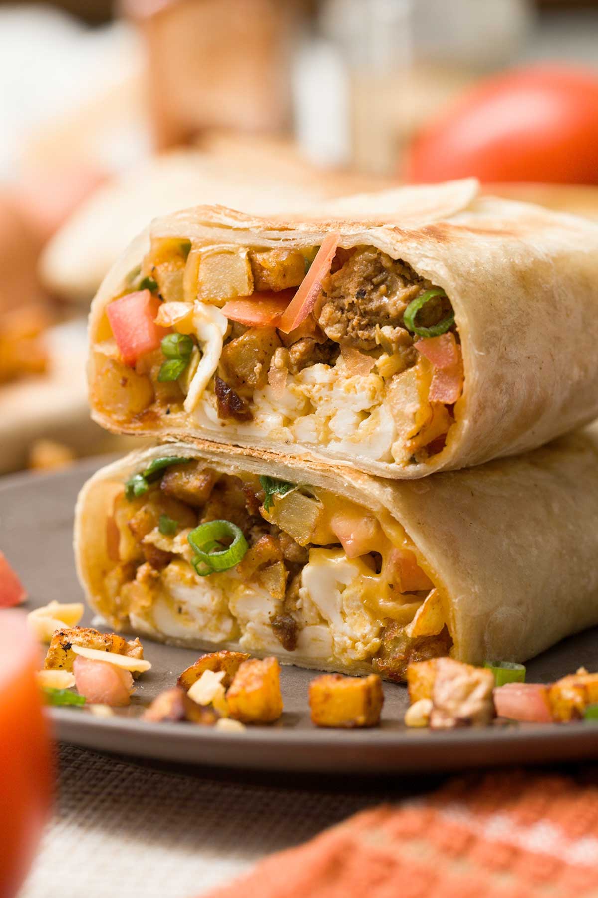 A view of the inside of two halves of a breakfast burrito stacked on top of each other.